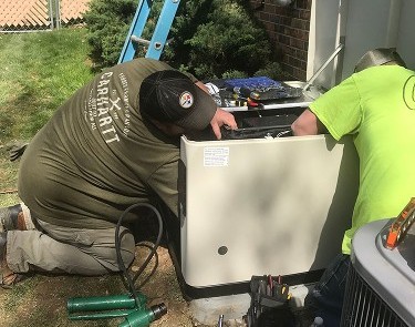 Workers Repairing a Generator